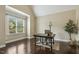 Cozy home office with dark hardwood floors, natural light, and vaulted ceilings at 347 Country Mill Way, Fuquay Varina, NC 27526
