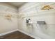 A walk-in closet has wire shelving for optimal storage solutions with wood-look floors at 347 Country Mill Way, Fuquay Varina, NC 27526