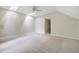 Large carpeted bedroom featuring a ceiling fan and two skylights letting in lots of light at 3511 Shady Creek Dr, Durham, NC 27713