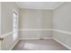 Neutral bedroom with carpet, trim, and a large window offering natural light at 3511 Shady Creek Dr, Durham, NC 27713