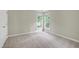 This room features two windows letting in natural light, neutral walls, and carpeted floors at 3511 Shady Creek Dr, Durham, NC 27713