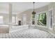 Bright breakfast nook with ample windows, allowing abundant light and views of the private backyard at 3511 Shady Creek Dr, Durham, NC 27713
