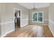 Bright dining area with hardwood floors and a window offering outdoor views at 3511 Shady Creek Dr, Durham, NC 27713