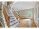 Bright foyer featuring hardwood floors, a staircase, and ample natural light at 3511 Shady Creek Dr, Durham, NC 27713
