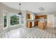 Kitchen features wood cabinets, white appliances, and a cozy eating area with an expansive view at 3511 Shady Creek Dr, Durham, NC 27713