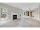 Spacious living room featuring a fireplace, neutral walls, and seamless flow into the kitchen at 3511 Shady Creek Dr, Durham, NC 27713