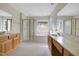 Large bathroom featuring dual sinks, a shower stall, and a bathtub with a window view at 3511 Shady Creek Dr, Durham, NC 27713