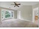 Large main bedroom with vaulted ceilings, ceiling fan, and natural light from a bay window at 3511 Shady Creek Dr, Durham, NC 27713