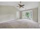 Large main bedroom with vaulted ceilings, ceiling fan, and natural light from a bay window at 3511 Shady Creek Dr, Durham, NC 27713