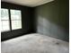 This bedroom features carpeted floors and windows that let in natural light at 4040 Tyler Dr, Oxford, NC 27565
