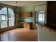 Sunlit dining area with large windows and built-in cabinets, creating a welcoming space for meals at 4040 Tyler Dr, Oxford, NC 27565