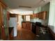 Bright kitchen with wooden cabinets, updated appliances, and ample counter space for cooking at 4040 Tyler Dr, Oxford, NC 27565