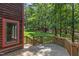 Spacious wooden deck with scenic views of the backyard and surrounding greenery at 4110 Stoneycreek Rd, Chapel Hill, NC 27514