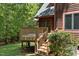 Charming wooden deck perfect for outdoor relaxation and entertaining surrounded by lush greenery at 4110 Stoneycreek Rd, Chapel Hill, NC 27514
