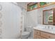 Neutral bathroom with a wood framed window and a white shower curtain at 4110 Stoneycreek Rd, Chapel Hill, NC 27514