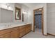 Bright bathroom featuring double vanity sinks and an adjoining bathroom with a shower at 4110 Stoneycreek Rd, Chapel Hill, NC 27514