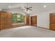Bright carpeted bedroom with built in cabinets and window seat nook at 4110 Stoneycreek Rd, Chapel Hill, NC 27514