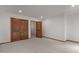 Neutral bedroom featuring a walk-in closet, wood doors, and wall-to-wall carpeting at 4110 Stoneycreek Rd, Chapel Hill, NC 27514