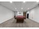 Spacious game room featuring a pool table, dart board, and neutral carpet, perfect for entertaining and recreation at 4110 Stoneycreek Rd, Chapel Hill, NC 27514