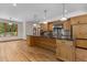Spacious kitchen with a large island, stainless steel appliances and hardwood floors at 4110 Stoneycreek Rd, Chapel Hill, NC 27514