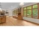 Living room with hardwood floors, large windows and built in cabinets at 4110 Stoneycreek Rd, Chapel Hill, NC 27514
