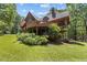 This home has a deck, screened in porch, and is surrounded by lots of trees at 4110 Stoneycreek Rd, Chapel Hill, NC 27514