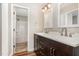 Bathroom featuring double sinks, a large mirror, modern fixtures, and a combined tub and shower unit at 5437 Advantis Dr, Raleigh, NC 27610