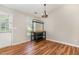 Inviting dining area with stylish wood floors, natural light, and modern chandelier, perfect for Gathering meals at 5437 Advantis Dr, Raleigh, NC 27610