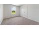Neutral bedroom with large window and a double door closet at 55 Fern Ridge Dr, Cameron, NC 28326