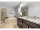 Elegant bathroom featuring a soaking tub, glass shower, and double vanity with granite countertops at 633 Copper Beech Ln, Wake Forest, NC 27587