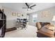 Comfortable bedroom with neutral walls, a ceiling fan, and dual desks for a home office at 633 Copper Beech Ln, Wake Forest, NC 27587