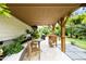 Covered patio with outdoor kitchen and dining area at 633 Copper Beech Ln, Wake Forest, NC 27587