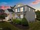 Well-maintained home with a cozy front porch and lush landscaping in a Gathering-friendly neighborhood at 633 Copper Beech Ln, Wake Forest, NC 27587