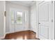 Bright foyer with hardwood floors, a decorative glass front door, and neutral walls, creating a welcoming entry at 633 Copper Beech Ln, Wake Forest, NC 27587