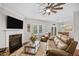 Spacious living room features a fireplace, hardwood floors, and lots of natural light at 633 Copper Beech Ln, Wake Forest, NC 27587
