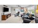 Entertainment room with leather furniture, a large TV, fan and decor celebrating the Cincinnati Bearcats at 633 Copper Beech Ln, Wake Forest, NC 27587