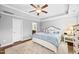 Spacious main bedroom with king bed, neutral walls, ceiling fan, and ensuite bathroom at 633 Copper Beech Ln, Wake Forest, NC 27587