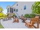 Spacious backyard patio with multiple seating areas and a stainless steel grill at 633 Copper Beech Ln, Wake Forest, NC 27587