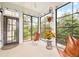 Bright sunroom with expansive views and modern furnishings at 633 Copper Beech Ln, Wake Forest, NC 27587