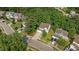 Aerial view highlighting the home's location within a lush, green neighborhood at 648 Long Melford Dr, Rolesville, NC 27571