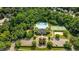 Aerial view of the community pool, tennis courts, playground, and surrounding lush greenery at 648 Long Melford Dr, Rolesville, NC 27571
