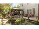 Beautiful backyard oasis with a pond, mature landscaping, a covered patio, and a separate seating area at 648 Long Melford Dr, Rolesville, NC 27571
