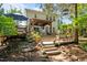 Expansive backyard with multiple seating areas, a covered patio, and lush landscaping for outdoor enjoyment at 648 Long Melford Dr, Rolesville, NC 27571