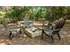 Relaxing backyard fire pit area with Adirondack chairs, perfect for outdoor gatherings at 648 Long Melford Dr, Rolesville, NC 27571