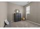 Neutral bedroom with carpet, small armoire, bench seat, and window at 648 Long Melford Dr, Rolesville, NC 27571