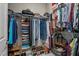 Organized walk-in closet features ample storage with clothing racks and shelves at 648 Long Melford Dr, Rolesville, NC 27571