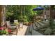 Cozy wooden deck with comfortable seating, offering a tranquil outdoor retreat surrounded by lush greenery at 648 Long Melford Dr, Rolesville, NC 27571