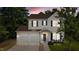 Charming two-story home with a well-manicured lawn, lovely landscaping, and a two-car garage at 648 Long Melford Dr, Rolesville, NC 27571