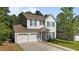 Charming two-story home with a two-car garage and beautiful landscaping at 648 Long Melford Dr, Rolesville, NC 27571