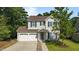 Charming two-story home with a two-car garage and beautiful landscaping at 648 Long Melford Dr, Rolesville, NC 27571